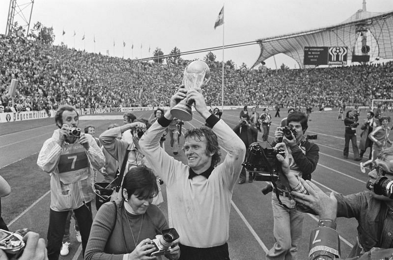 A jubilant Sepp Maier holds the World Cup trophy aloft after West Germany's remarkable World Cup victory in 1974